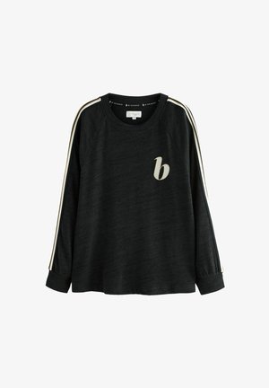 Čierna mikina s dlhým rukávom a raglánovými rukávmi, zdobená krémovými pruhmi po stranách a malým béžovým logom vpredu. Mäkkučká textúra.