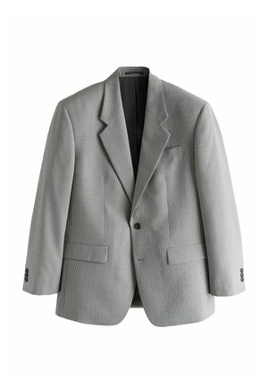 Man adjusting cuff of houndstooth patterned suit jacket with white shirt and dark textured tie visible.