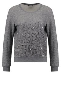Pull gris à manches longues avec col rond, présentant des ornements complexes en sequins noirs et argentés formant un motif tourbillonnant sur le devant.