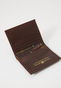 Brown leather wallet featuring a zippered coin pocket, card slots, and a textured fabric lining with a tartan pattern. Gold embossed logo included.