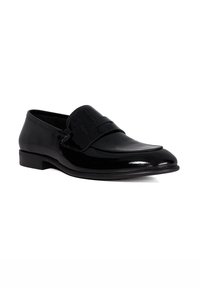Black leather loafers with a polished finish. Rounded toe, decorative strap across the upper, and a low profile heel. Smooth texture.