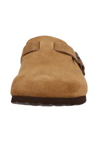 Suede slip-on shoe in tan with a smooth texture, featuring a brown adjustable buckle strap and a low, molded rubber sole.