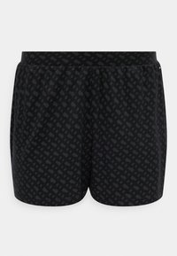 Μαύρο αθλητικό σορτς με διακριτικό σκούρο γεωμετρικό μοτίβο και ελαστική μέση, εμφανιζόμενο σε απλό λευκό φόντο.