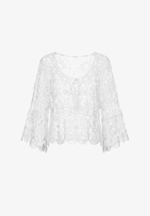 Witte kanten gehaakte blouse met klokmouwen en bloemenmotieven, met een ronde hals met een strik en kwastdetail.