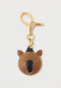Barna műanyag lófej kulcstartó arany színű fémalkatrészekkel. Fekete sörénnyel és fülekkel, kerek formájú, fényes felületű.
