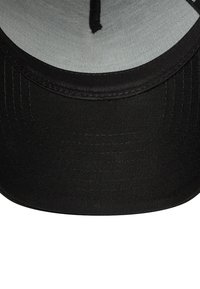 Black baseball cap with a flat brim, featuring a gray inner lining and neat stitching along the edges, made from durable fabric.