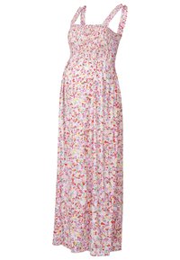 Robe maxi avec un corsage smocké et de fines bretelles volantées. Fabriquée en tissu léger, elle présente une base rose ornée d'un imprimé floral coloré.