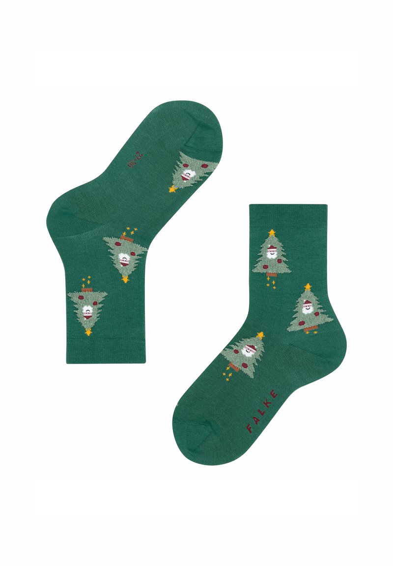 Grüne Socken mit einem gestrickten Design, das cartoonhafte Weihnachtsbäume und weiße Gesichter zeigt. Enthält rote Akzente und Details mit goldenen Sternen.
