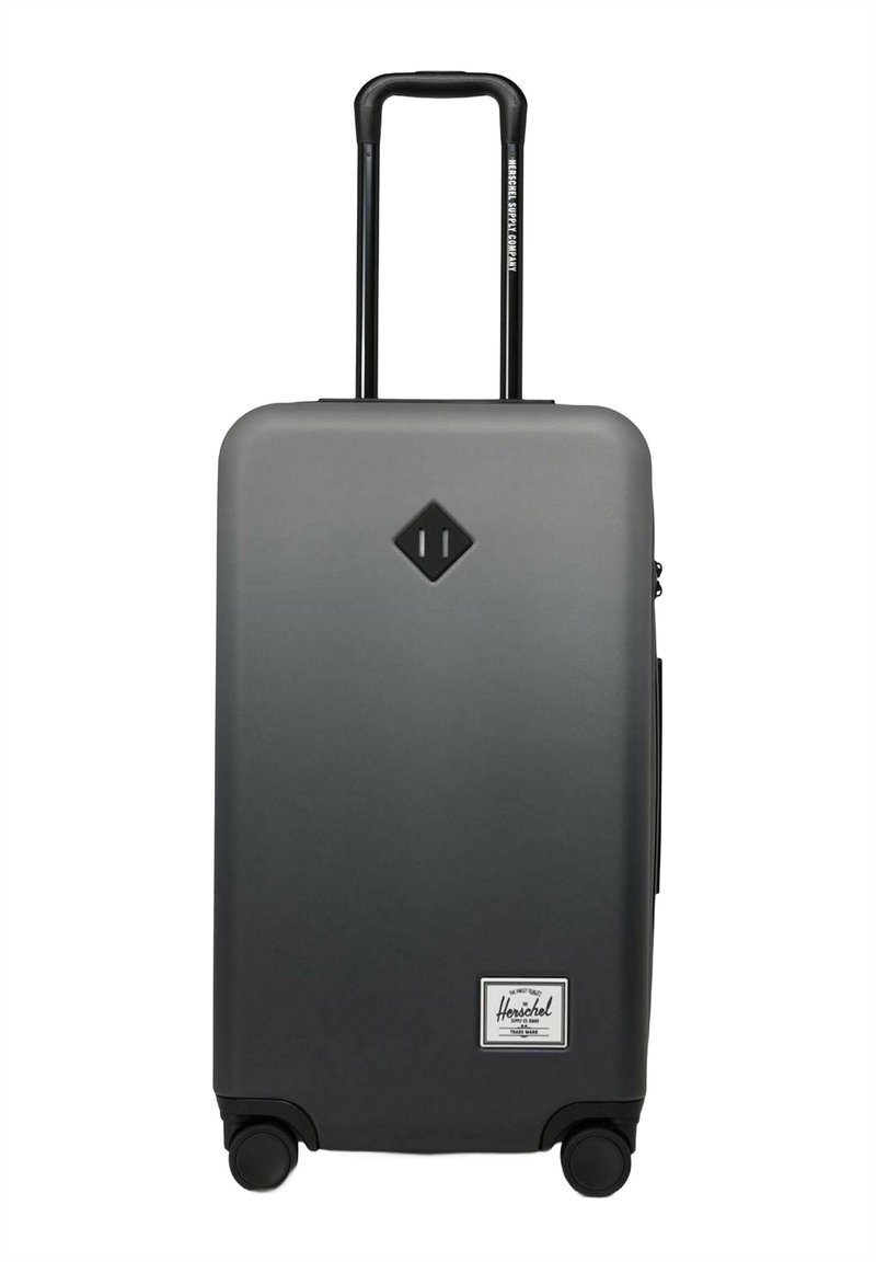 Grauer Hartschalenkoffer mit Teleskopgriff, vier Rädern und schwarzem Diamond-Logo über dem weißen Herschel-Label nahe der Unterseite.