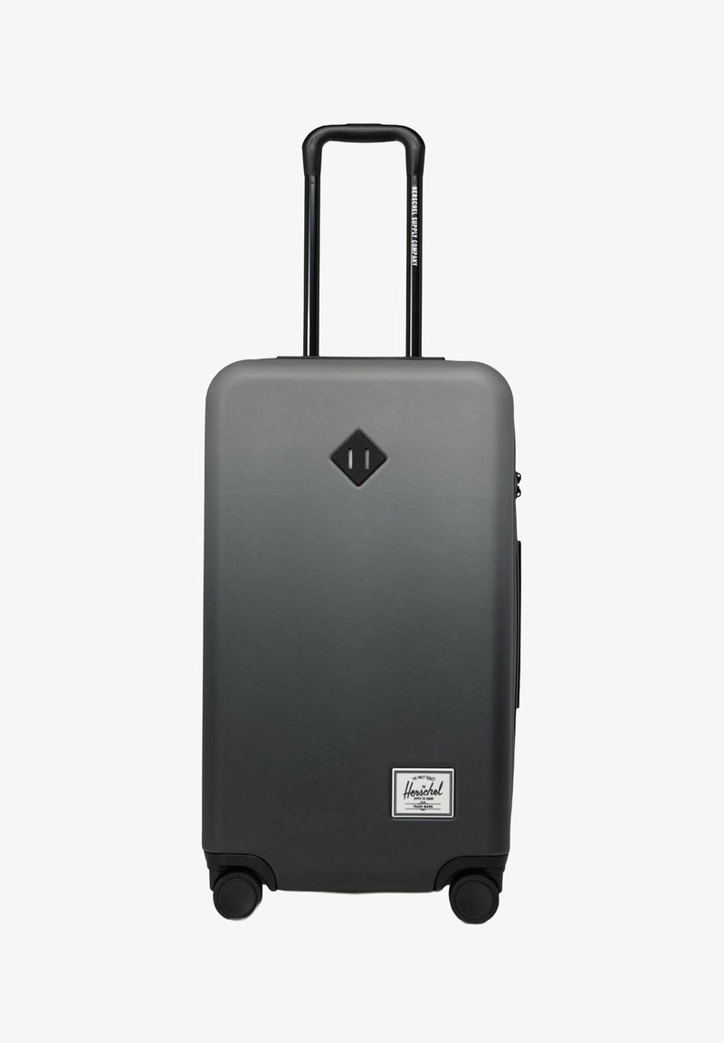 Grauer Hartschalenkoffer mit Teleskopgriff, vier Rädern und schwarzem Diamond-Logo über dem weißen Herschel-Label nahe der Unterseite.