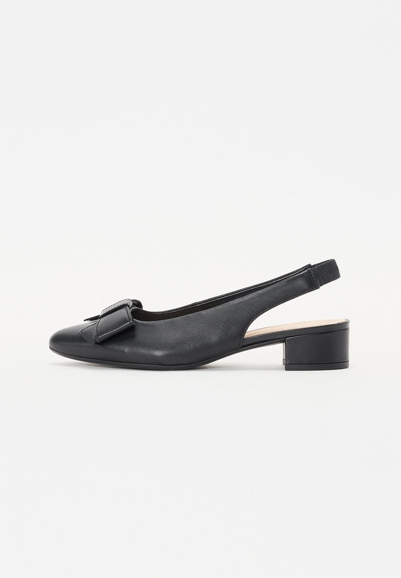 Black leather slingback shoe featuring a rounded toe, small block heel, and a decorative bow on the front. Smooth texture and minimalist design.