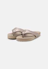 Flip-flops with a metallic rose gold upper, soft strap design, and a beige rubber sole with textured grip, featuring a low-profile shape.