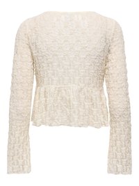 Blouse crème à manches longues avec motif floral texturé, taille ajustée et ourlet peplum, vue de dos.