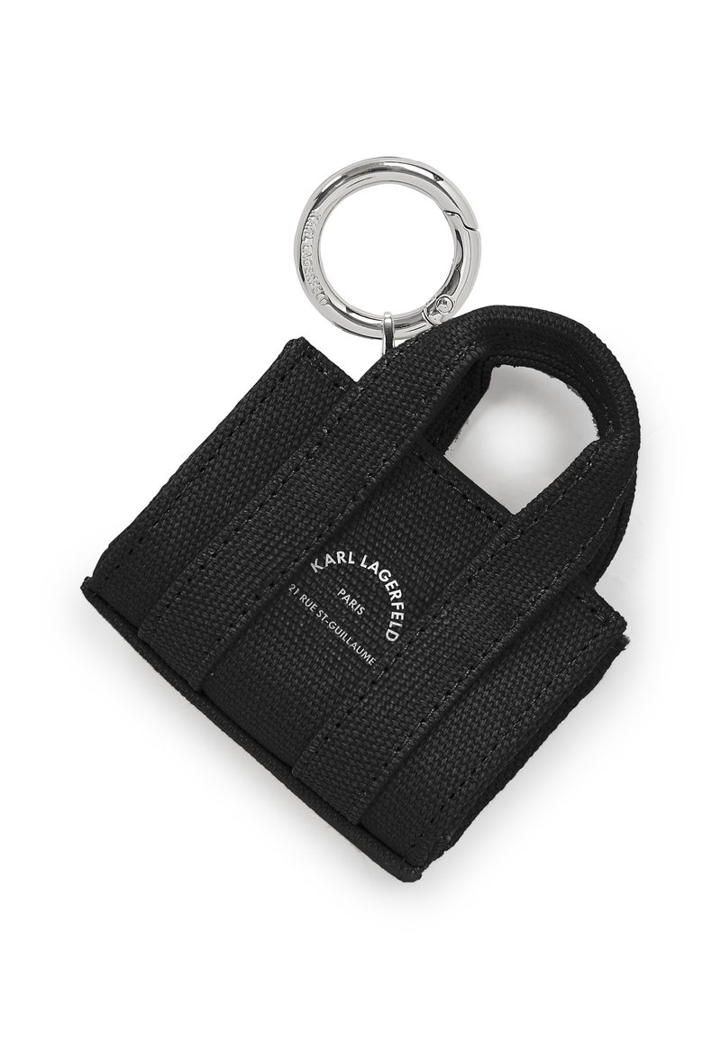 Maza melna auduma soma atslēgu piekariņš ar divām rokturiem, sudraba metāla gredzenu un logotipu drukātu vienā pusē. Teksturēts materiāls.