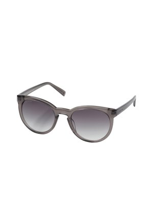 Graue Gradient-Sonnenbrille mit einer runden, Katzenaugenform. Hergestellt aus leichtem Kunststoff mit schlanken Bügeln und subtiler Markenkennzeichnung auf einer Seite.