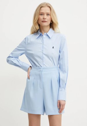 A RIGHE CON SPACCO SU RETRO - Camicia - azzurro