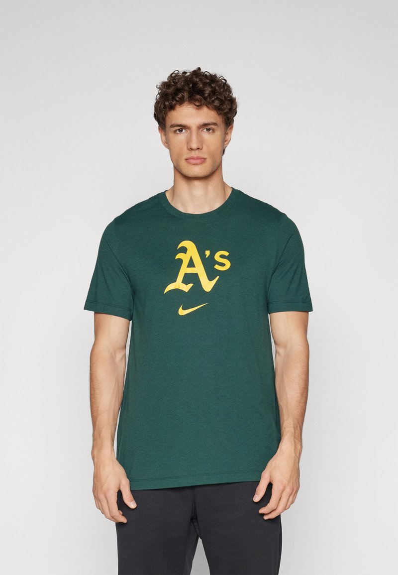 Zelené bavlnené tričko s veľkým žltým logom "A's" a emblémom Nike. Krátke rukávy a okrúhly výstrih s voľným strihom.