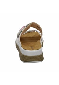White sandal with a textured gray upper and pink accent, featuring an open back and a cork insole. Rubber outsole with ridged detail.