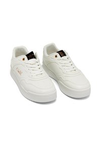 White sneakers with a smooth leather upper, rounded toe, and textured detailing on the side. Features laces and a gold-accented insole.