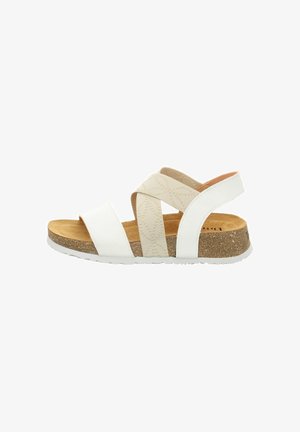 Open-toe sandal with white synthetic straps and a beige cross design. Cork footbed and white rubber sole provide comfort and support.