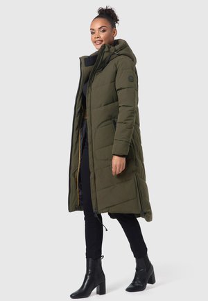 Long olive green padded coat with a hood, featuring zip closure, side pockets, and a textured interior lining. Worn over dark pants and boots.