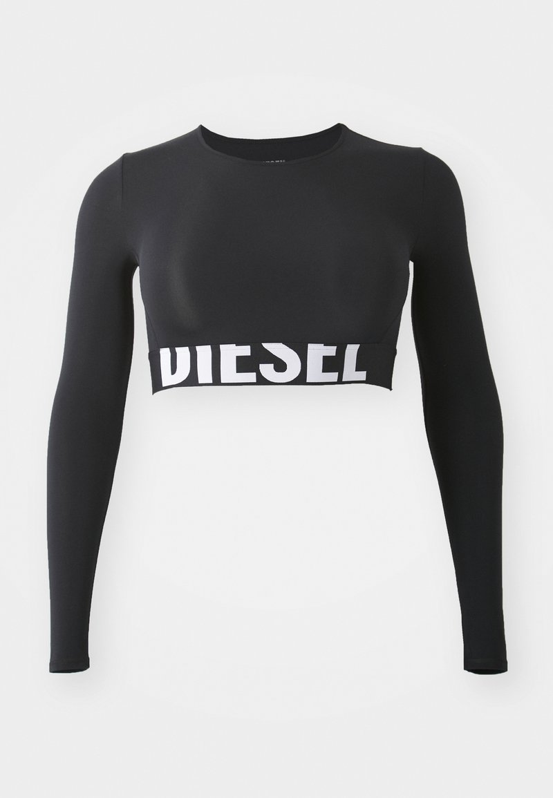 Svart langermet crop top laget av glatt, elastisk stoff; har et bredt hvitt "DIESEL"-logobånd i kanten.
