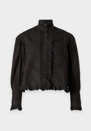 Svart, teksturert bluse med høy krage, knappeåpning, volanger og dekorative mønstre. Har pufferte lange ermer.