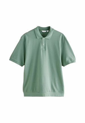 Polo in verde chiaro, realizzato in misto cotone. Maniche corte, colletto a coste, patta con due bottoni e vestibilità comoda. Tessuto liscio e testurizzato.