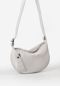 Light gray leather shoulder bag with a curved shape, adjustable strap, and diagonal zipper pocket on the front for added detail.