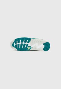 Σολά παπουτσιού Nike με σχέδιο σε τιρκουάζ και λευκό. Ορατά ανάγλυφα μοτίβα για καλύτερη πρόσφυση και κίτρινο λογότυπο στην πλευρά.