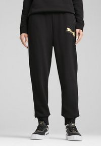 Puma - ESS JOGGING - Verryttelyhousut - black metallic gold Pienoiskuva 1