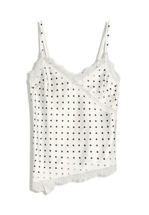 Witte satijnen cami met zwarte stippen, kanten rand langs de halslijn en zoom, en dunne verstelbare schouderbandjes.