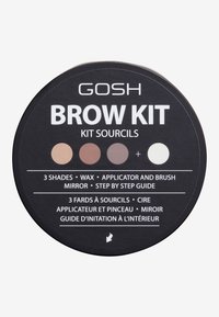 Kit de sourcils dans un emballage noir circulaire comportant trois teintes de produits pour sourcils, cire, applicateur, pinceau et miroir. Inclut un guide étape par étape.