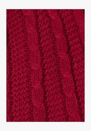Tela de punto roja con un patrón texturizado y tejido suelto que presenta trenzas verticales. El material parece suave y grueso.