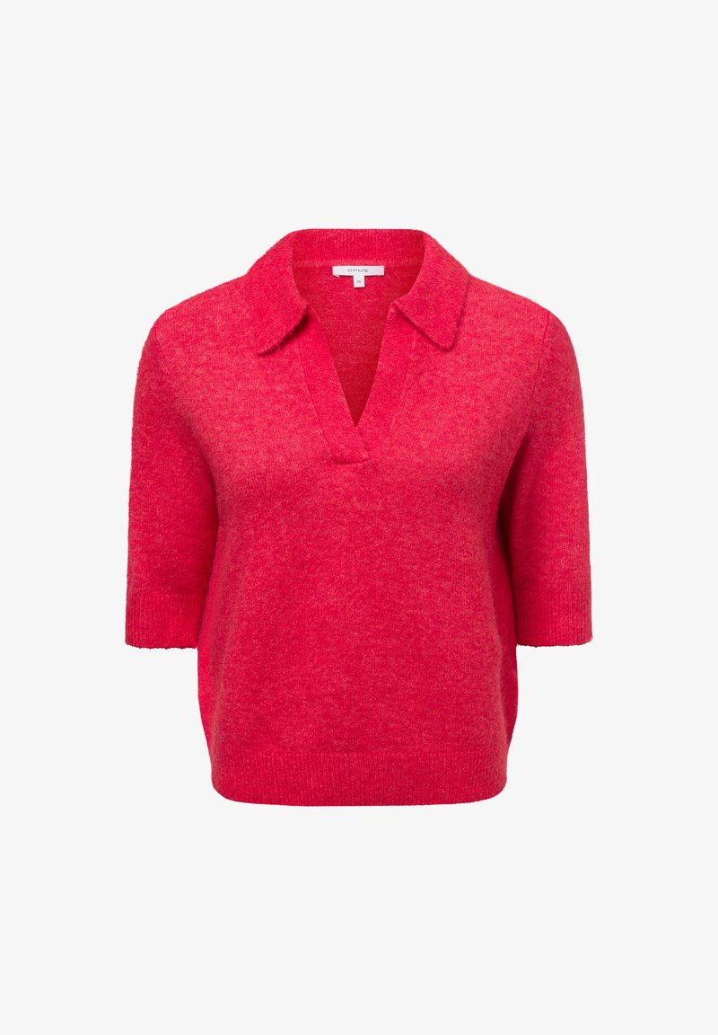 Pull en polo à manches courtes de couleur rose vif. Présente un col en V, une coupe décontractée et une texture douce. Fabriqué en tricot léger.
