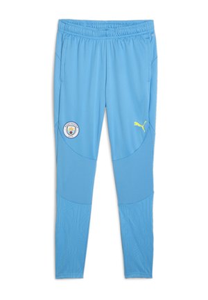 Gaiši zili sporta bikses, izgatavotas no teksturētas auduma, ar sānu kabatām, Mančestras City logo un dzelteno Puma logo akcentu.