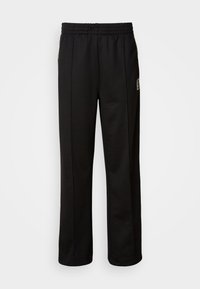 Calvin Klein STRIPE - Trainingsbroek - black