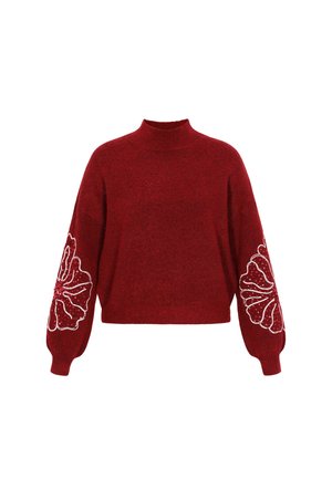 Červený pletený svetr s vysokým límcem, širokými dlouhými rukávy a květinovou výšivkou na rukávech zdobenou bílými korálky.