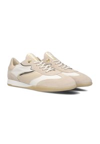 Beige suede and leather sneakers with white and cream accents. Features gold hardware and textured laces. Rubber sole with a slight elevation.