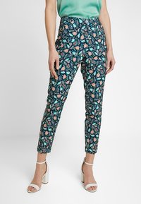 Floral-patterned trousers featuring a dark blue background with pink and green botanical designs, made of lightweight fabric, slim fit design.
