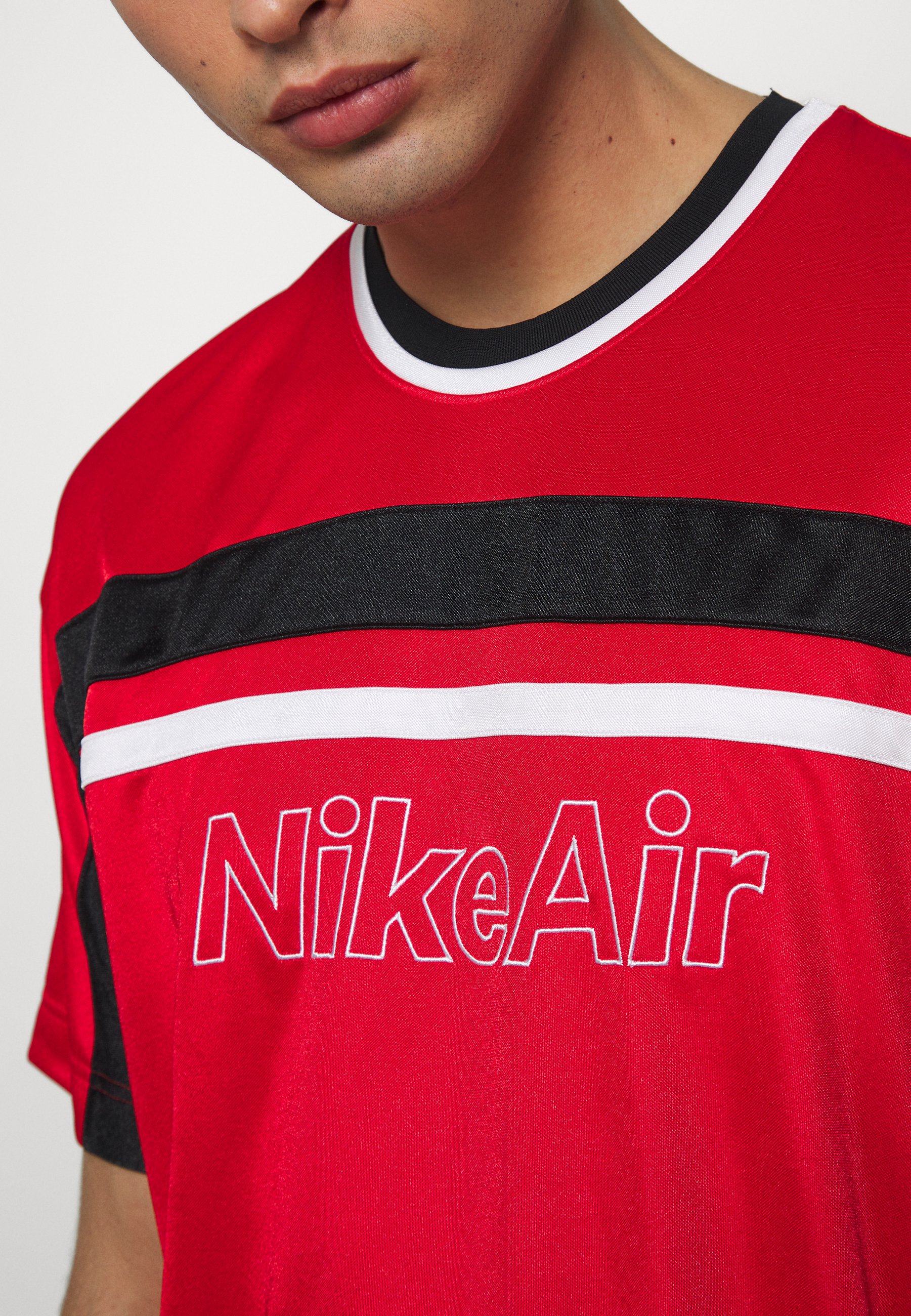 red black and grey nike shirt