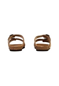 I sandali in sughero marrone presentano cinturini regolabili, una superficie liscia e una suola piatta. Il design include un leggero tacco e uno stile minimalista.