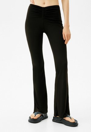 WITH RUCHED DETAIL - Pantaloni - black