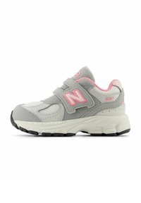 Gray and pink New Balance 2002R sneaker with suede and mesh materials, velcro straps, cushioned sole, and rubber outsole.