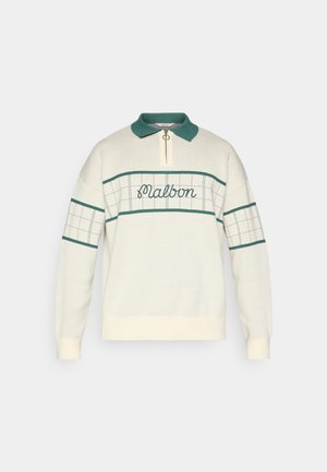 Pulover v krem barvi z zelenim ovratnikom in zadrgo na vratu. Ima karo vzorce in vezen napis "maibon" čez prsni del.