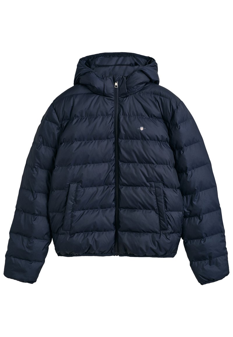 Navy puffer jacket with a hood, featuring a quilted design, front zipper, and two side pockets. Made from a shiny, lightweight material.