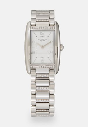 Silver rectangular wristwatch with a polished metal bracelet. Features a white analog face, silver hour markers, and accent stones on the band.