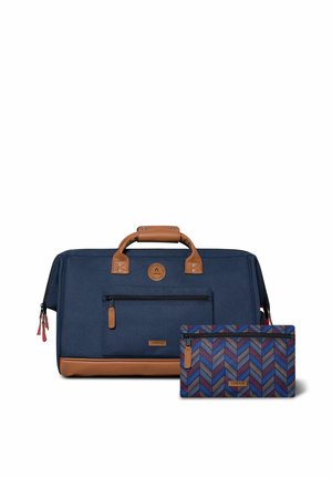 Navy fabric duffel bag with brown leather accents, a front zipper pocket, and a matching patterned pouch featuring a herringbone design.