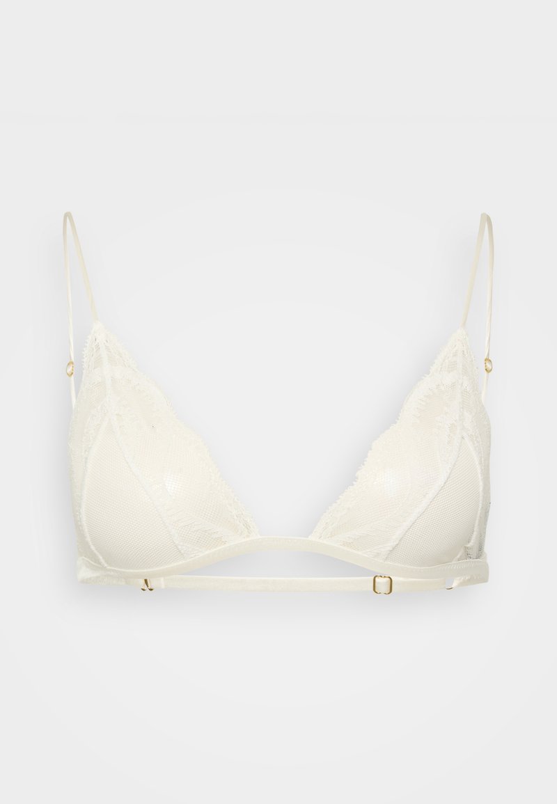 Bralette avorio con pizzo, dotato di coppe morbide, spalline regolabili e un accento in metallo dorato sulla fascia. Presenta un design trasparente e texturizzato.