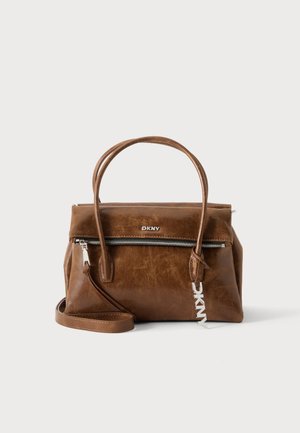 Brown leather DKNY handbag with double handles, front zip pocket, detachable shoulder strap, and silver brand logo on a white background.